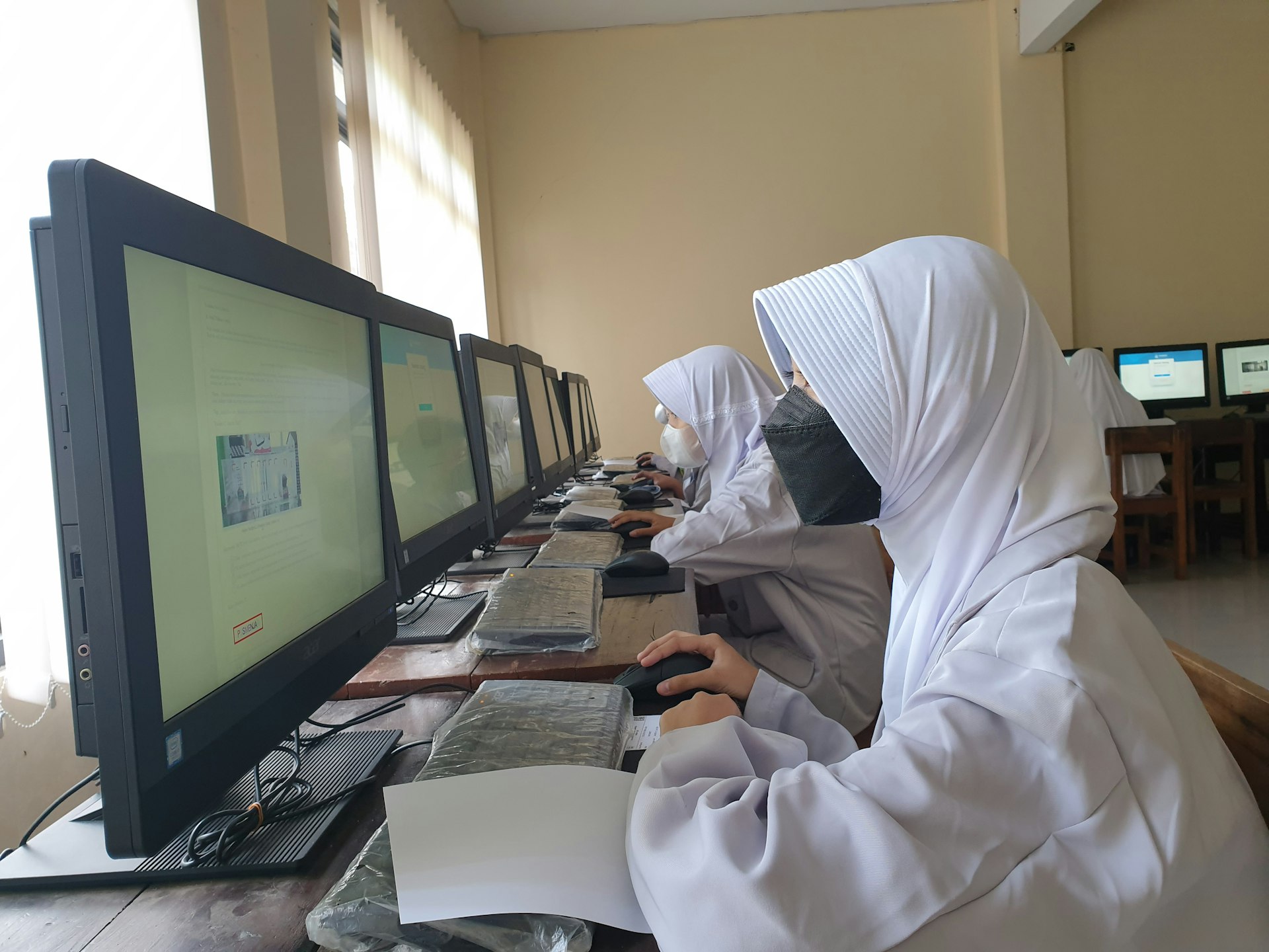 a couple of people working on computers